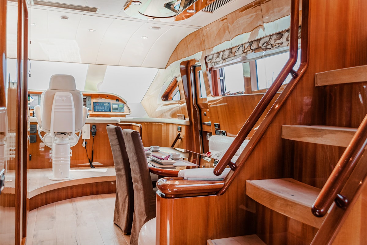Warm wood-paneled boat cabin interior where a cool-to-touch EMBER Pro heater is safe to brush against in tight quarters