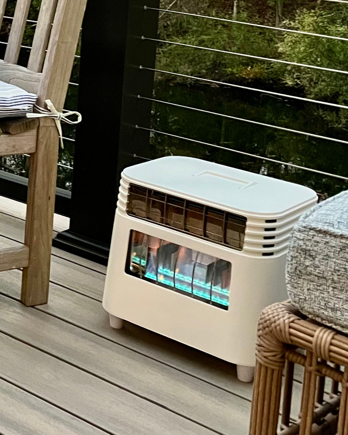 BlazOn EMBER cordless forced-air propane heater in matte white, mid-century design, zero electrical draw.